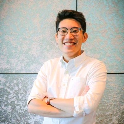 JJ Andy Lim — Head of Digital Transformation and AI Product Manager based in Singapore, smiling with arms crossed